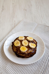 Homemade Banana Pancakes with Honey, side view. Copy space.