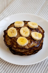 Homemade Banana Pancakes with Honey, side view. Close-up.