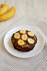 Homemade Banana Pancakes with Honey, low angle view.