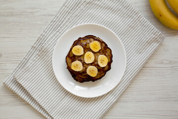 Homemade Banana Pancakes with Honey, overhead view. Flat lay, top view, from above.