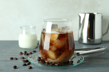 Concept of cold drink with ice coffee on wooden table