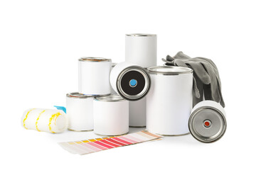 Paint cans with supplies on white background
