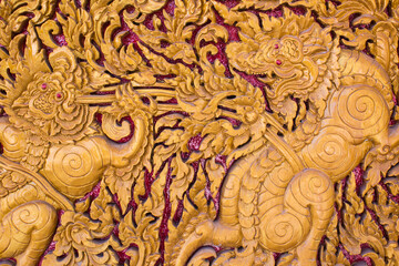 Carved lion Thai style art on door