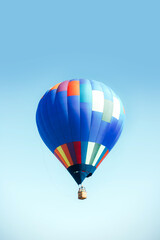 Striped hot air balloon in the sky.