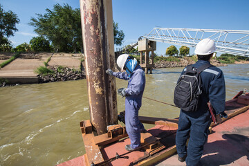 Male worker inspection and measurement thickness pipeline oil