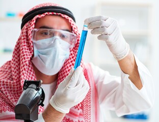 Arab chemist working in the lab office