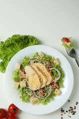 Concept of tasty eating with Caesar salad on white background