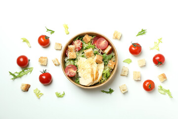 Fototapeta na wymiar Concept of tasty eating with Caesar salad on white background