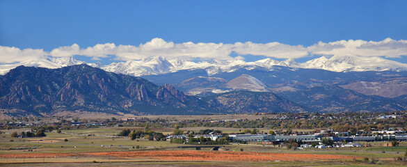 The spectacular Boulder FlatIrons and the  snow-capped front range of the colorado rocky  mountains...