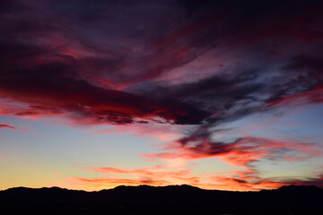 Fototapeta na wymiar Multi-colored sunset over the front range of the rocky mountains of colorado. as seen from broomfield, colorado