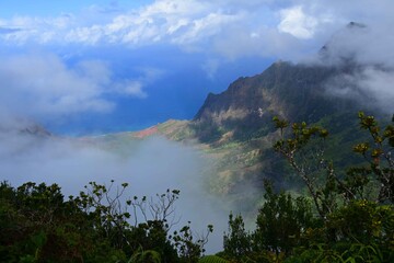 scenic overlook over foggy knife-edged  kalalau valley and the pacific ocean in kauai, hawaii      