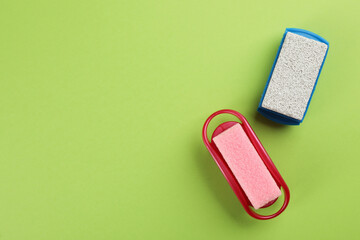 Pumice stones on green background, flat lay. Space for text