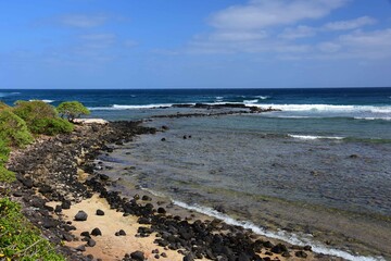 Fototapeta na wymiar pretty beach and coastline on a sunny day along the kauai path, north of kapa'a, kauai, hawaii