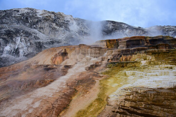 colorful travertine terraces and hot spring run off at minerva  terrace at mammoth hot springs in summer in yellowstone national park, wyoming