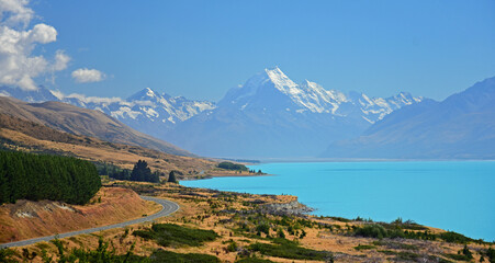 spectacular view of mount cook and turquoise-colored lake pukaki in summer along the road  from twizel to mount cook village, on the south island of new zealand