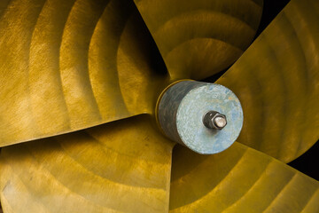 Five-bladed ship propeller close-up, with zinc corrosion protection in the center