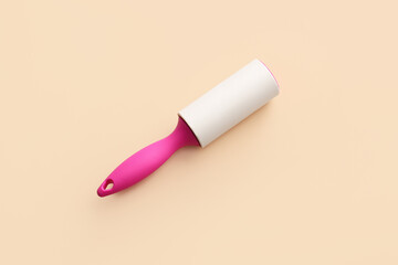 Lint roller on color background