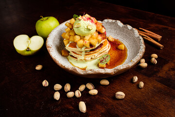 tasty pancakes with maple syrup and fruits