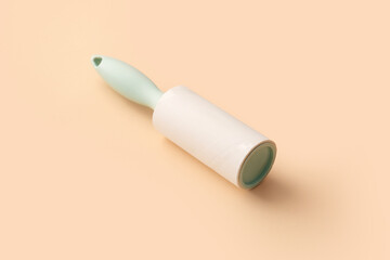 Lint roller on color background