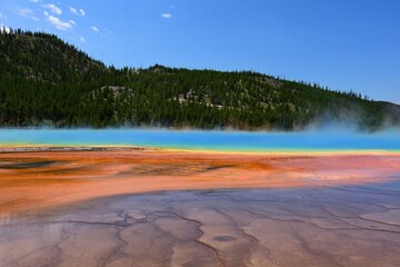 the very colorful grand prismatic spring and microbial mat on a sunny  day in yellowstone national...