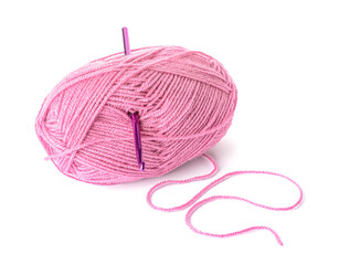 Knitting yarn and crochet hook on white background