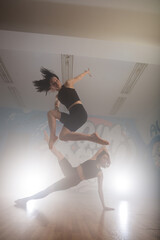 Group of multiracial dancers are exercising and practicing in their studio in slow motion