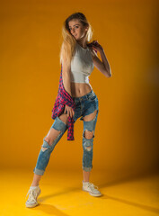 Young Woman In Yellow Tanktop And Eye Glasses Against Yellow Background