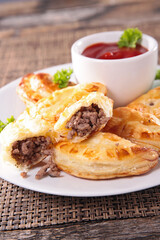 empanadas with beef and spicy dipping sauce