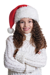 Portrait of smiling little girl in Santa hat