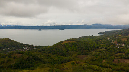 Large lake Lanao and rain clouds view from above. Mindanao, Lanao del Sur, Philippines.