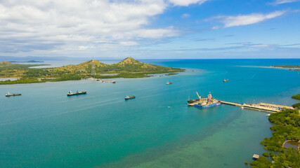 Cargo ships and tankers in the sea Harbour waiting for loading and unloading. Seaport, Tapal Wharf,...