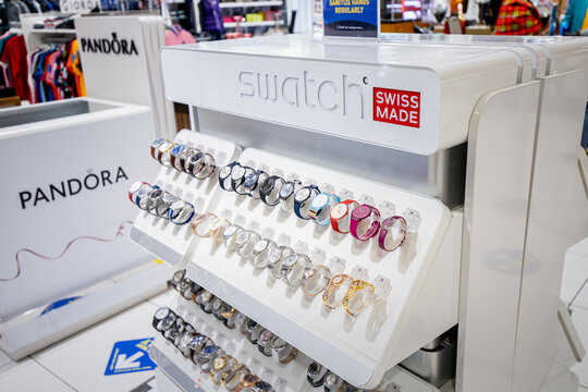 26 February 2021, Dubai, UAE: Many Swatch watches in wristwatch and accessory shop