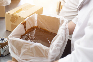 Packing of hot chocolate and chocolate paste in the manufacture of confectionery. Making custard condensed milk and cream for cakes, raw materials