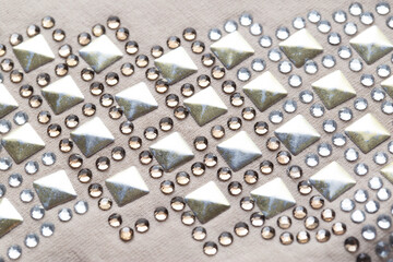 Silver sequins and rhinestones on clothes, macro. Garments, fashionable
