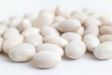 Fototapeta na wymiar White beans on a white background, isolate, close-up