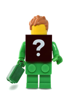 Lego minifigure green brick with black plate of question-mark. Editorial illustrative image of Mister X.