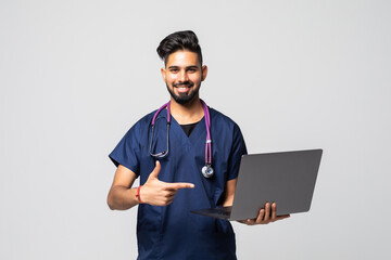 Naklejka na ściany i meble Doctor with laptop isolated on white background