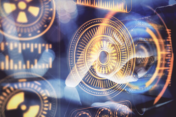 Double exposure of man's hands holding and using a digital device and tech theme hologram drawing. Technology concept.