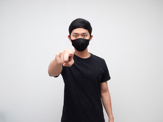 Asian man with mask serious face and point finger at you white background