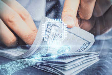 Double exposure of technology drawing hologram and us dollars bills and man hands. Data concept