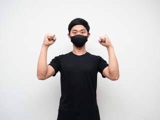Asian man with mask show double fist up confident face on white background