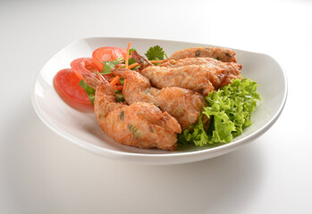 deep fried golden crispy prawn meat ball roll traditional wu Xiang with spicy sauce in white background asian halal snack menu
