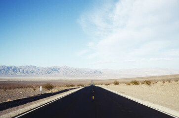 Fototapeta premium USA, DEATH VALLEY: Scenic landscape view of the desert mountains with the road