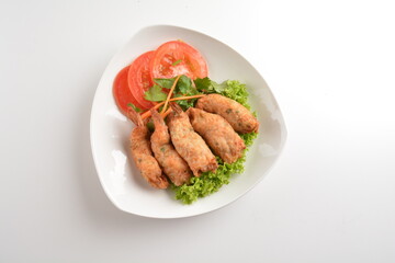 deep fried golden crispy prawn meat ball roll traditional wu Xiang with spicy sauce in white background asian halal snack menu