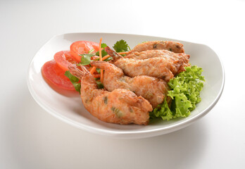 deep fried golden crispy prawn meat ball roll traditional wu Xiang with spicy sauce in white...