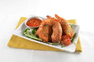 deep fried golden crispy prawn meat ball roll traditional wu Xiang with spicy sauce in white background asian halal snack menu