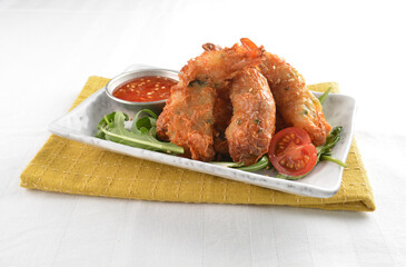 deep fried golden crispy prawn meat ball roll traditional wu Xiang with spicy sauce in white background asian halal snack menu