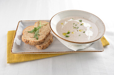 home made hot mushroom thick soup with French toast bread in white background western appetiser halal menu
