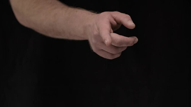 male hands on a black background