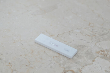 Negative SARS COV rapid antigen test on light background. Coronavirus crisis. Global pandemic.